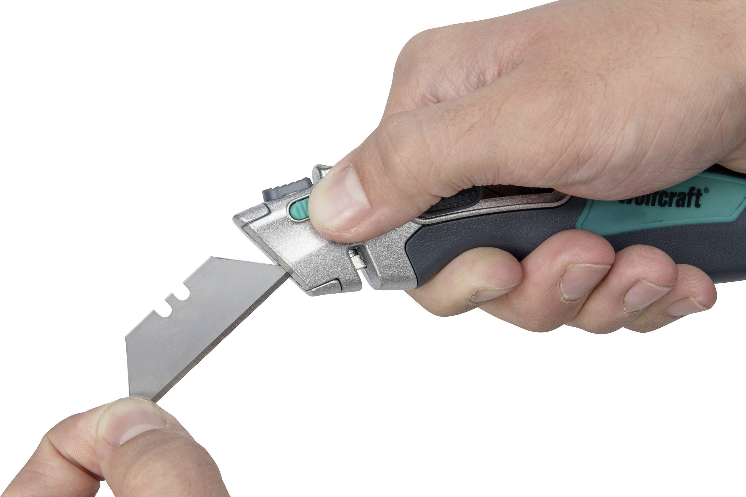 A person is holding a Swiss Army knife and changing the blade. The knife is blue and black. The hand grips the handle firmly.