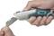 A person is holding a Wolfcraft universal cutting knife and changing the blade with their other hand.