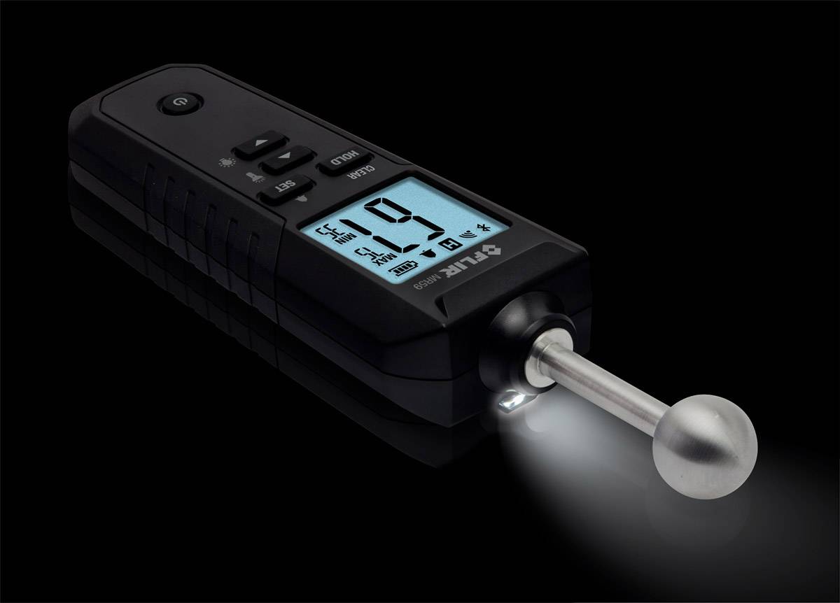 A digital measuring device on a black background with an illuminated display, showing '19'. Front panel with a metal ball and light switched on.