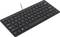A flat, black computer keyboard in English QWERTY layout with a cable, suitable for use with a PC or laptop.