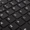 Keyboard with black keys and white letters. The top keys display special characters such as the pound sign (£).