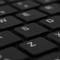 'Keyboard with a close-up of the S, D, Z, X keys. Black, minimalist design.'