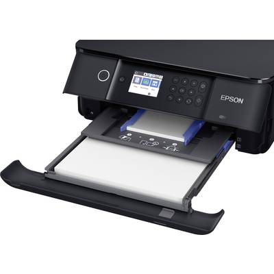 A black inkjet printer with an open paper tray and control panel. Symbols for various functions are visible on the display.