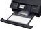 A black inkjet printer with an open paper tray and control panel. Symbols for various functions are visible on the display.
