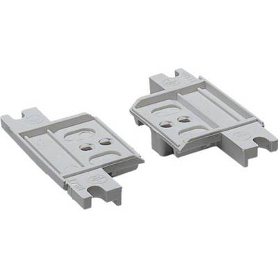 Two grey, rectangular plastic components with circular and rectangular cut-outs, lying side by side.