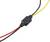 A black connector joins three wires: black, red, and yellow. Could be used for electrical circuits or wiring.