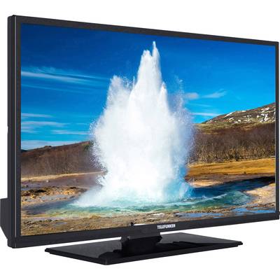 A picture shows a television with a photograph of an erupting geyser. In the background, landscape and blue sky can be seen.