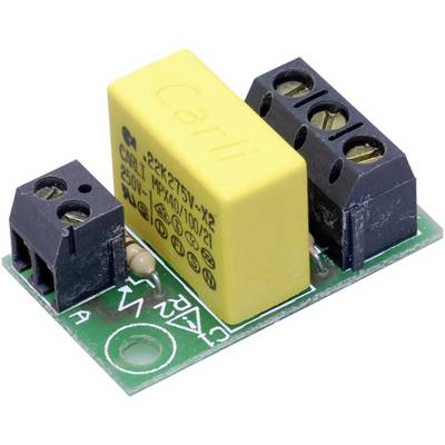 Close-up of an electronic circuit board with a yellow capacitor and two terminal blocks, mounted on a green circuit board.