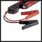 Red and black jump leads for car, with clamps and portable charger.