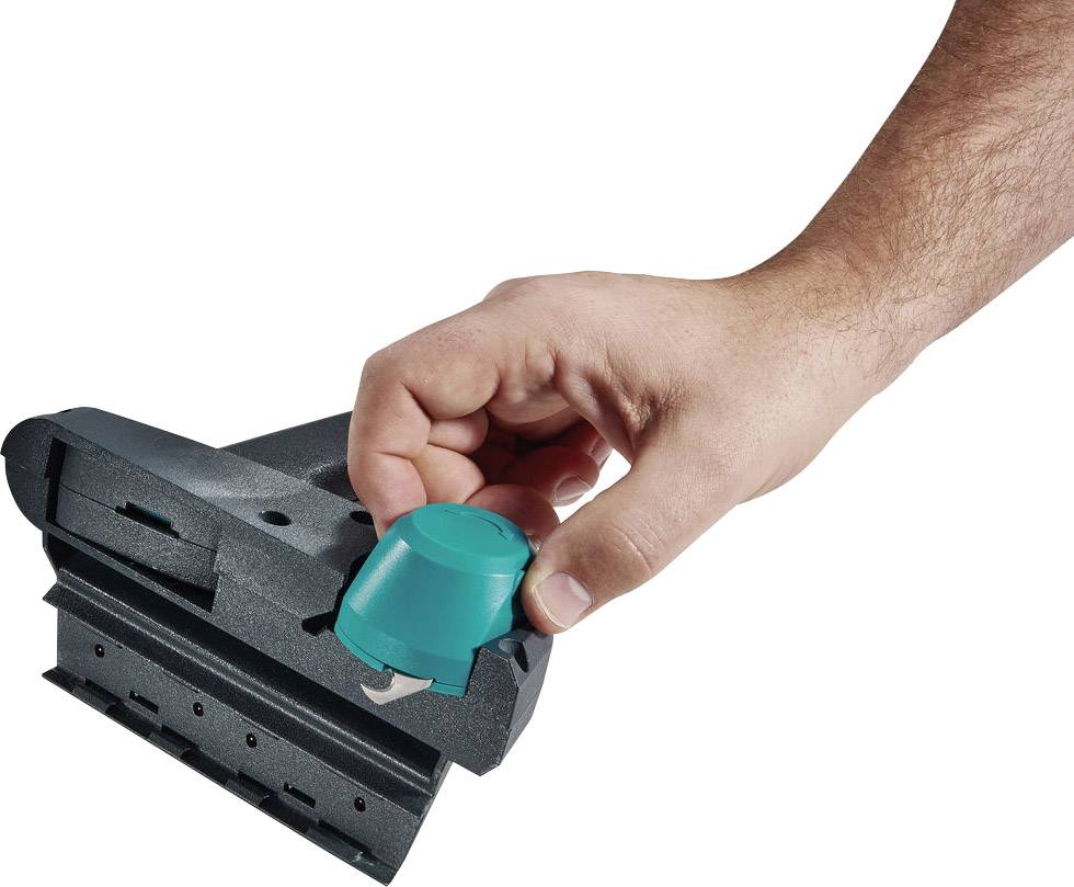 A hand is holding a green lever on a grey tool.