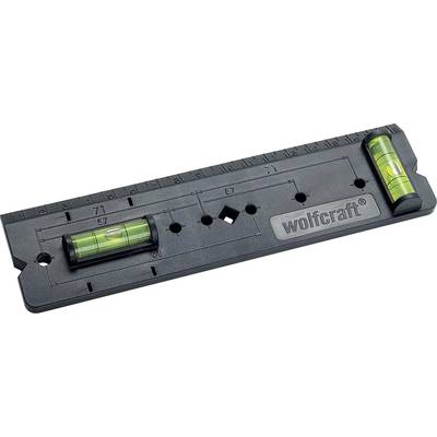 Spirit level with two vials and ruler, wolfcraft brand, for precise alignment and measurement on a flat surface.