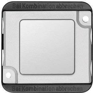 Light switch with the inscription 'Cancel when combining' at the edge. Rectangular shape with a grey switch in the centre.