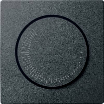 A dark, ridged rotary dial on a textured surface. No numbers or labels visible.