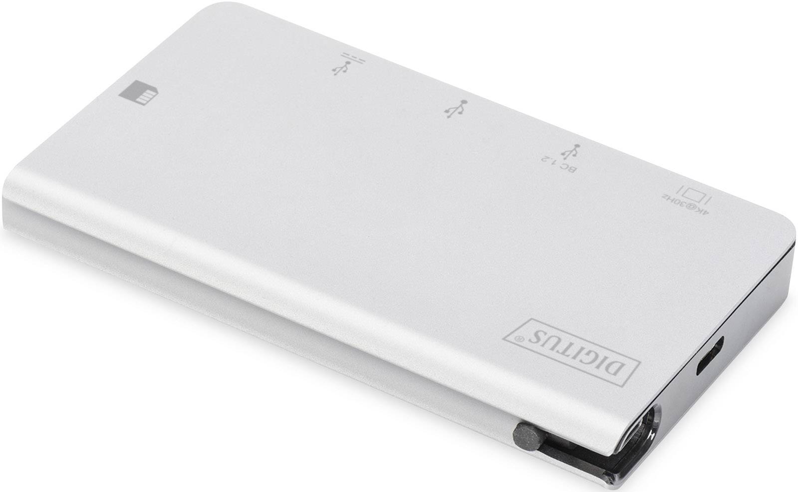 Flat, rectangular, silver device with a USB port, brand name 'Digitus'. Designed for connecting and linking devices.