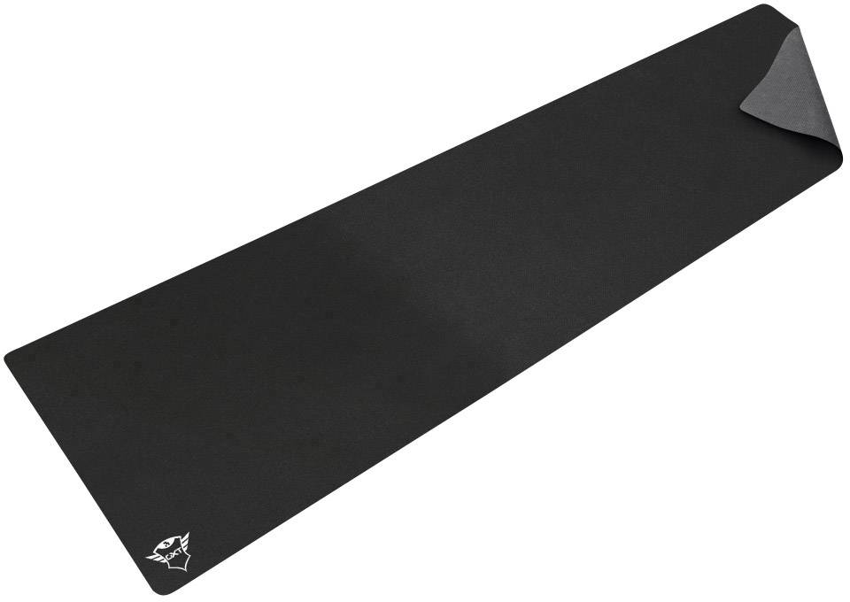 A large, black gaming mouse mat with a white logo in the bottom corner; the mat is slightly curled up on one side.
