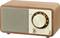 A classic wooden radio with a large tuning dial, a small volume knob, and a speaker grille on the left.