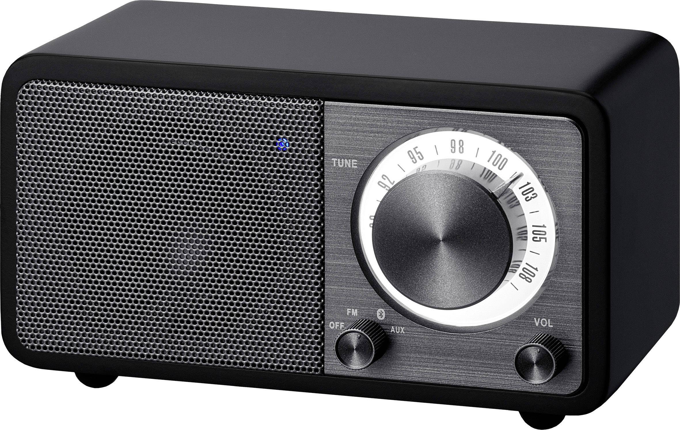 Black retro radio with speaker on the left and dial knobs for frequency and volume on the right. Frequency display highlighted.