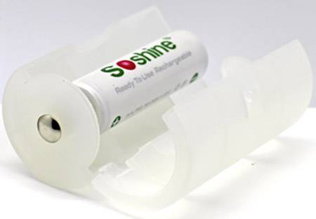 A plastic adapter holds a rechargeable AA battery, allowing it to be used in a C battery compartment.