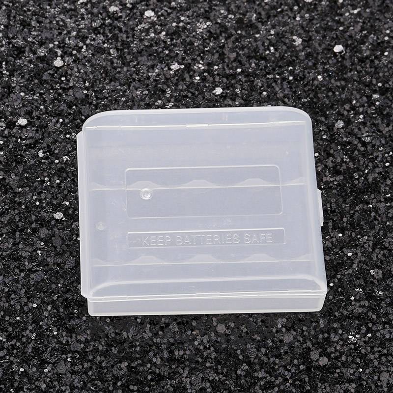 Transparent plastic storage box on a black background, with the inscription 'Keep Batteries Safe', designed for the secure storage of batteries.