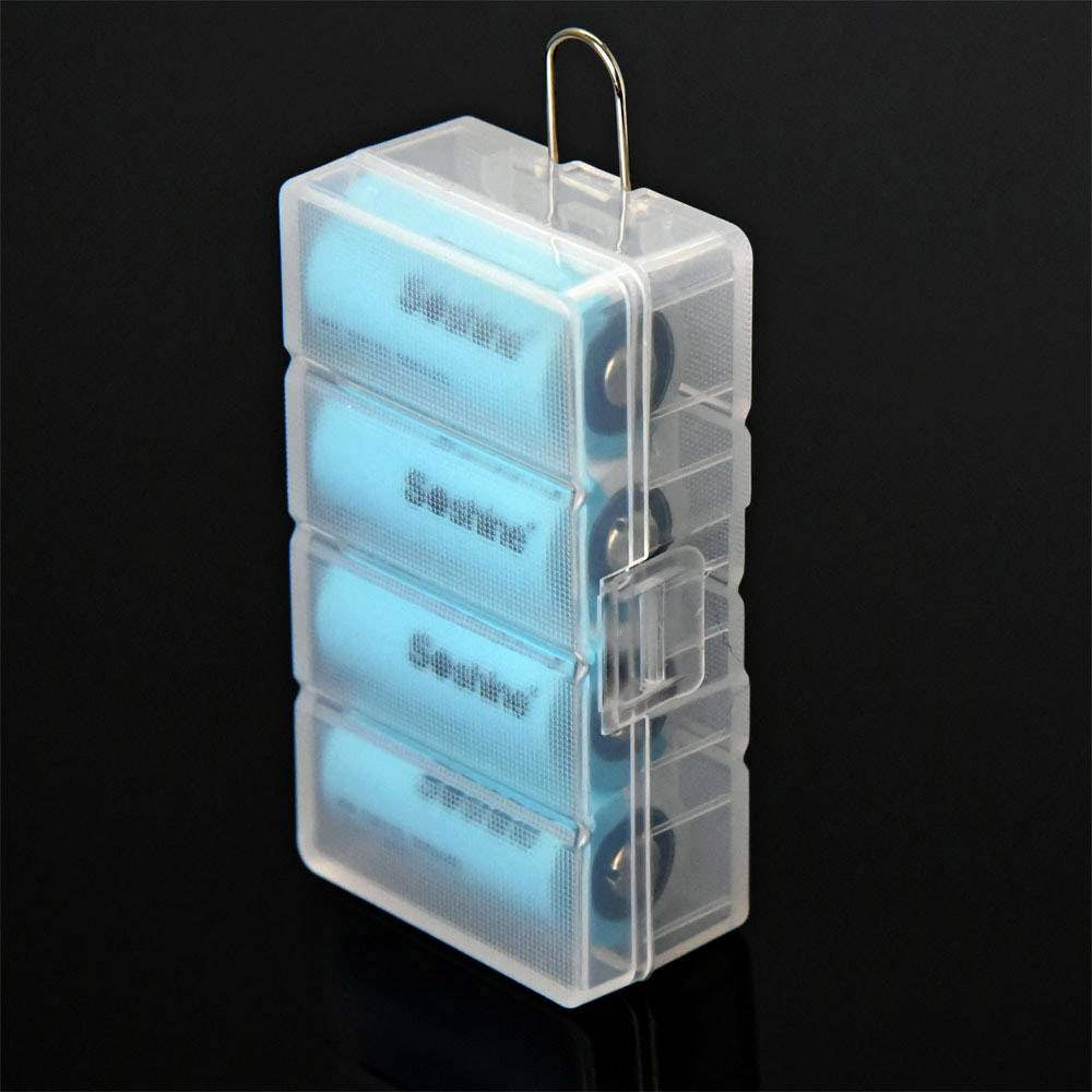 Clear plastic box containing four blue AA batteries, vertically stacked, against a black background.