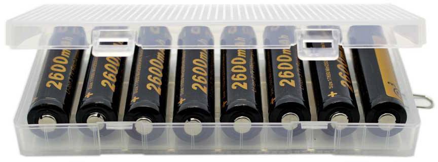A transparent box containing seven AA batteries, marked '2600mAh', arranged in a row.