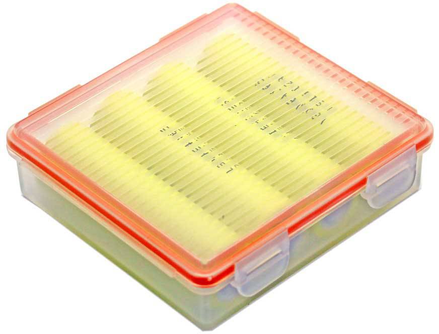 A transparent plastic box with a red lid shows yellow, evenly arranged sticks inside.