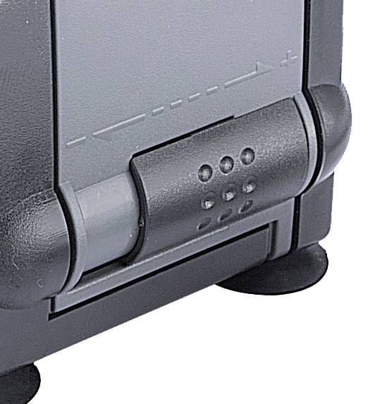 Close-up of a device with a control knob. The handle has small, raised dots on it.