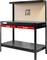 A robust black workbench with two red drawers and a perforated metal back panel, suitable for workshop tasks.