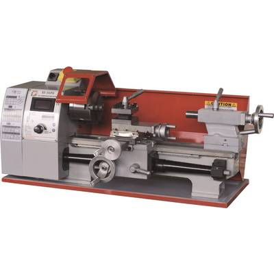 A red and grey bench lathe with control elements on the left side and a clamping device in the centre.