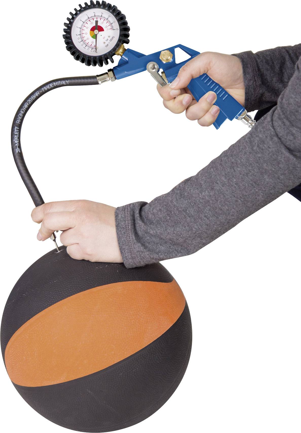 A person is inflating a basketball with a hand pump. The gauge on the pump shows the air pressure in the ball.