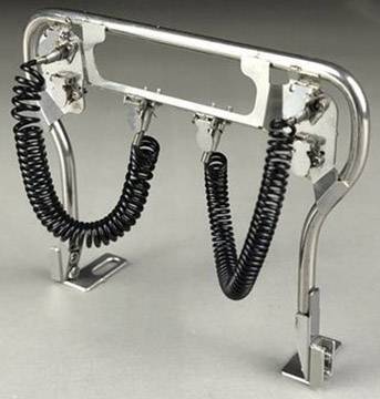 Metal construction with two spiral-shaped black cables, likely a holder or stand for an electronic device.