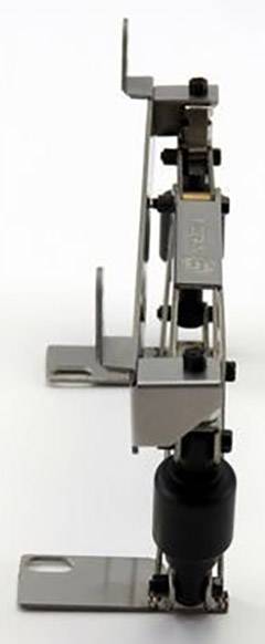 Metallic hinge with multiple movable parts, standing upright. Displays complex connecting elements for adjustment or fastening.