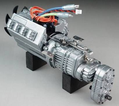 A silver mechanical motor with colourful cables, mounted on black stands, against a grey background.