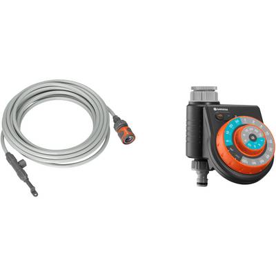 'Grey garden hose with orange connector' on the left, 'digital irrigation timer with display and buttons' on the right.