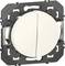 A round switch with a divided surface, mounted in a square frame.