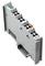 Grey-white electronic plug module with multiple connections, labelled on top. A barcode and printed code are located on the top left.