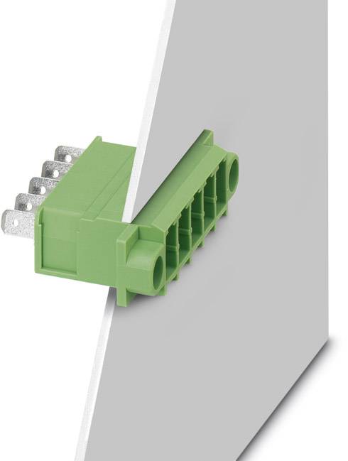 A green connector on a grey surface; shows the side view of an electrical connection system.