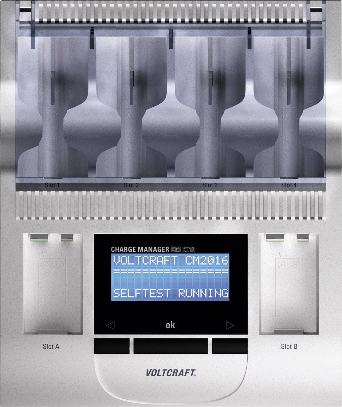 Charger with four charging slots at the top, display showing 'VOLTCRAFT CM2016 SELFTEST RUNNING', two switches at the bottom.