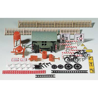 Miniature Railway Accessories: A small green building, barriers, signs and bicycles to create a construction site scene.