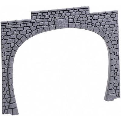 A stone bridge with an arched opening reveals intricate brickwork and worn surfaces.