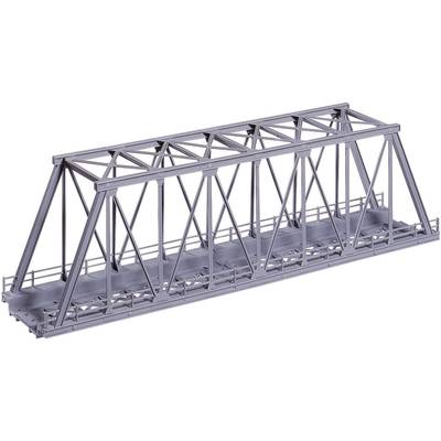 A grey steel truss bridge, photographed from the side, reveals the complex structure and architecture of its beams and bracing.