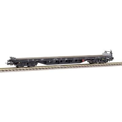 A flat railway wagon on tracks without load, suitable for transporting large goods.