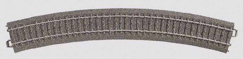 A curved piece of model railway track made from grey plastic, suitable for model railways.