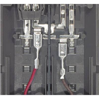 Close-up of an electricity meter with two wires, one red and one brown, connected to terminals.
