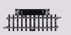 A railway track with a black-coloured switch positioned transversely across the track.