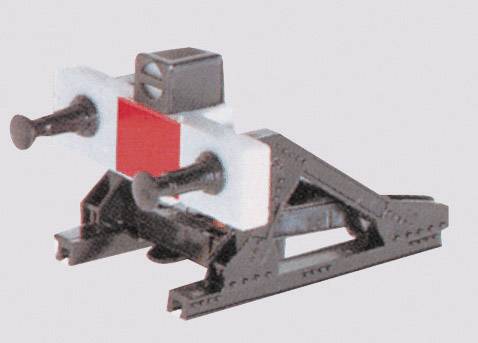 A black model railway buffer stop with white and red details on a grey background.