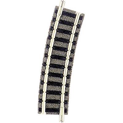A curved plastic and metal railway track segment that is part of a model railway layout.