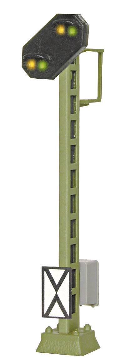 Railway signal with green and yellow lights, indicating 'Caution', mounted on a tall green post.