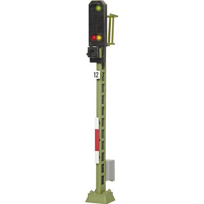 A railway signal light with green and red lights.