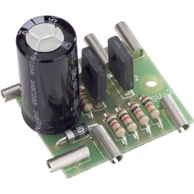 Electronic circuit board with a large capacitor, several resistors and connections on a green printed circuit board material.